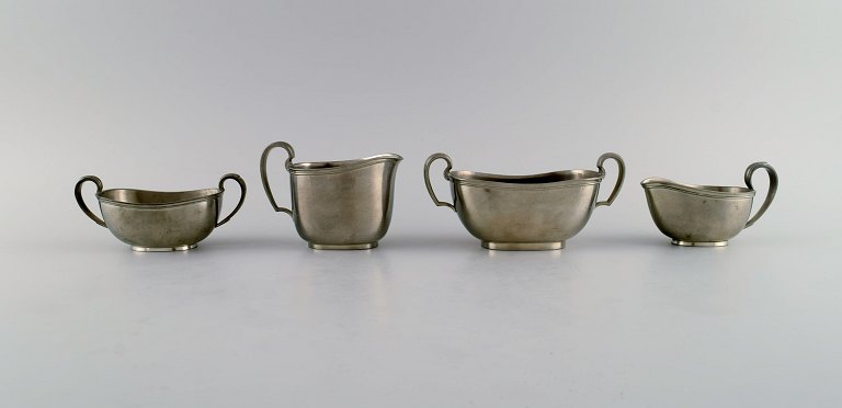 Just Andersen (1884-1943), Denmark. Two art deco tin sugar bowls and two 
creamers. 1940s.
