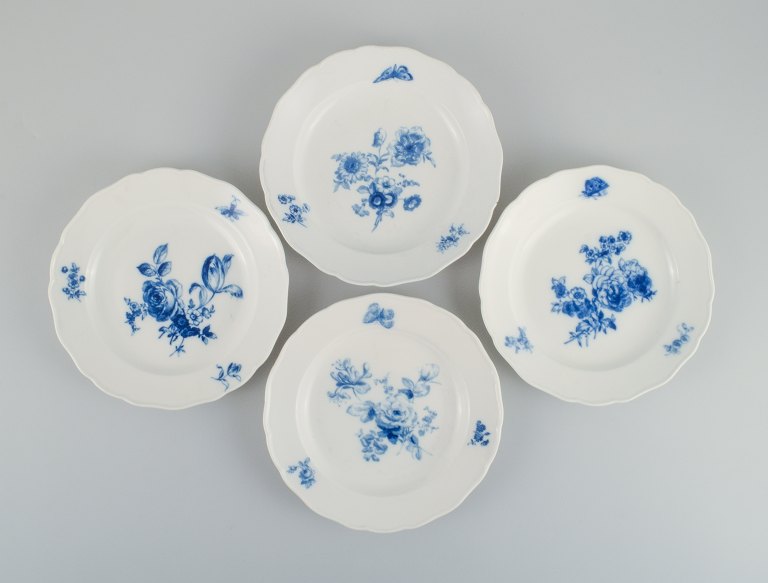 Four antique Meissen dinner plates.
Hand painted with various blue flowers and butterflies.