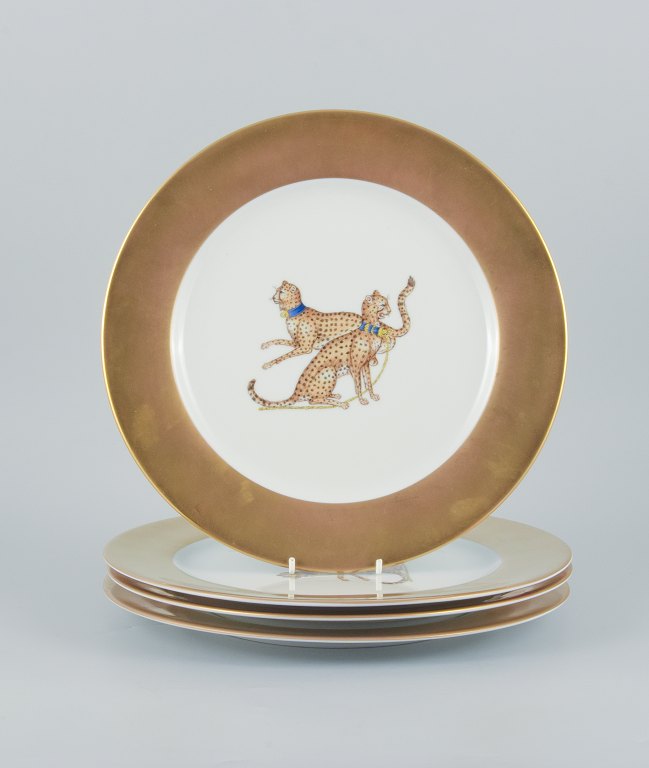 Porcelaine de Paris (Décor - Chasses Royales).
Four large cover plates hand decorated with cheetahs and gold decoration.