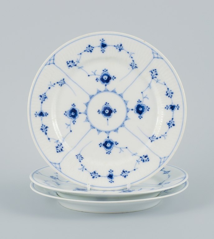 Royal Copenhagen, three Blue fluted plain lunch plates.