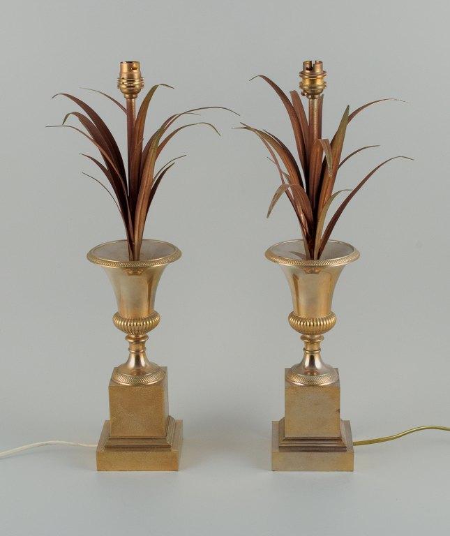 Charles & Fils, France.
A pair of table lamps in patinated metal, designed with palm leaves in a vase.
