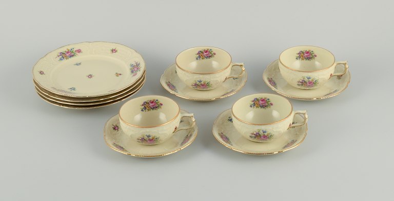 Rosenthal, Germany, "Sanssouci" four coffee cups with  saucers and cake plates 
decorated with flowers and gold.