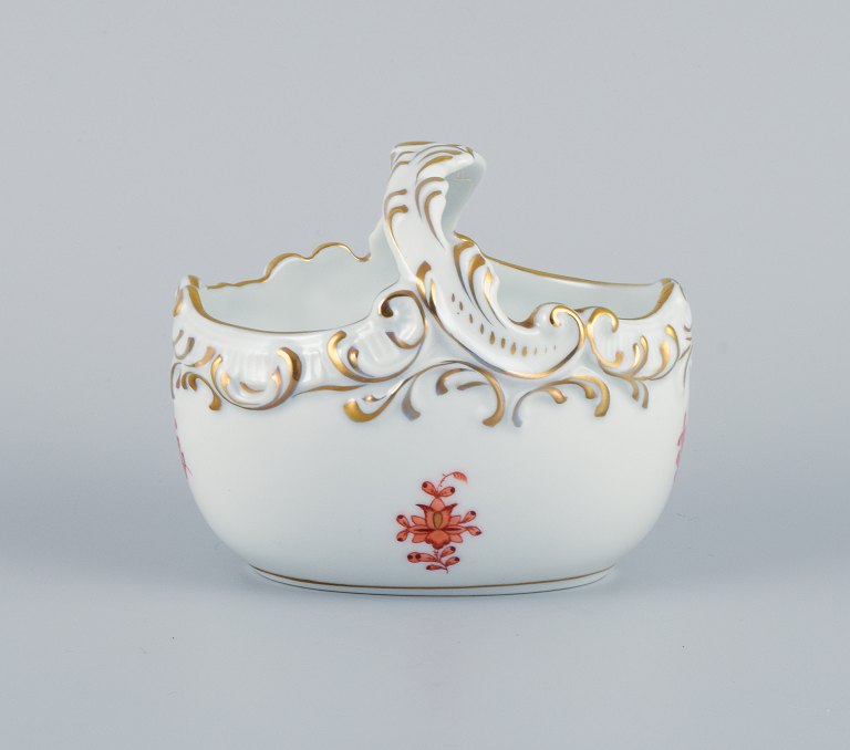 Herend, Hungary, porcelain bowl designed as a basket, hand painted with orange 
flowers.