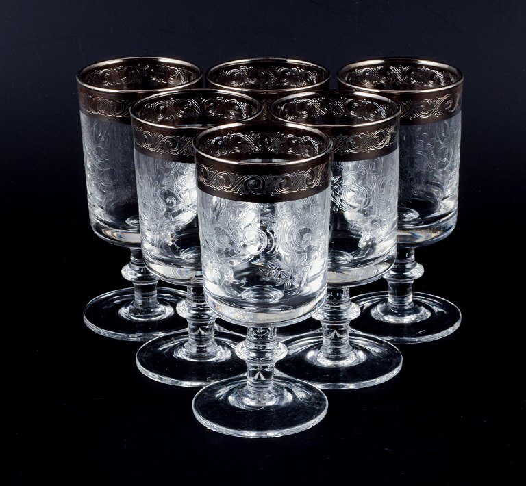 Murano, Italy, six mouth-blown and engraved dessert wine glasses with silver 
rim.