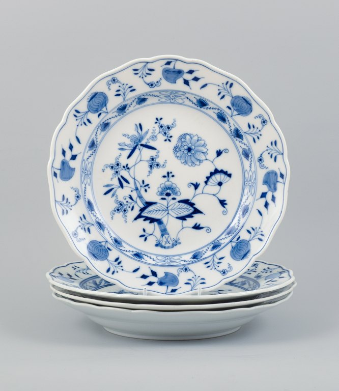 Meissen, Blue Onion pattern, a set of four hand painted dinner plates.