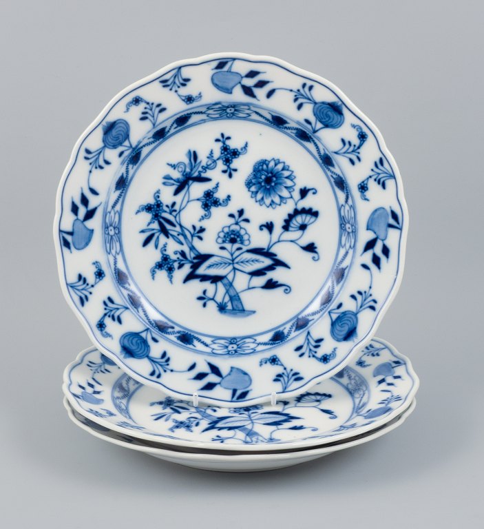 Meissen, Blue Onion pattern, a set of three hand painted dinner plates.