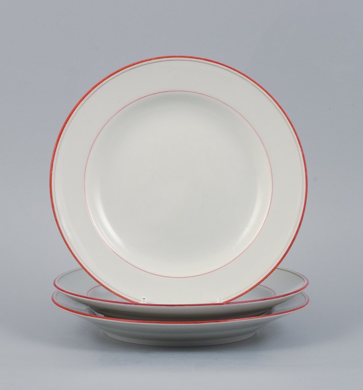 Meissen, Germany. Three plates with orange-red decoration.