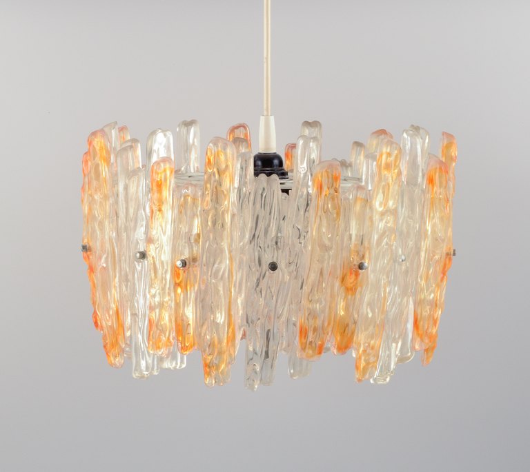 Franken Kalmar, Germany. Ice glass pendant in orange and clear acrylic glass.