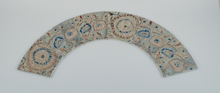 Royal Copenhagen, six Baca faience tiles with patterned glaze in brown, blue, 
green and sand colours.