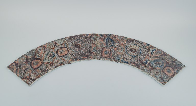 Royal Copenhagen, six Baca faience tiles with patterned glaze in brown, blue and 
green.