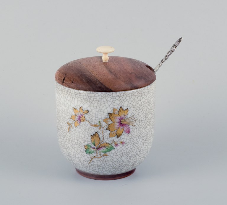 Bing & Grøndahl, jam jar in crackle porcelain with matching wooden lid and a 
Georg Jensen jam spoon.