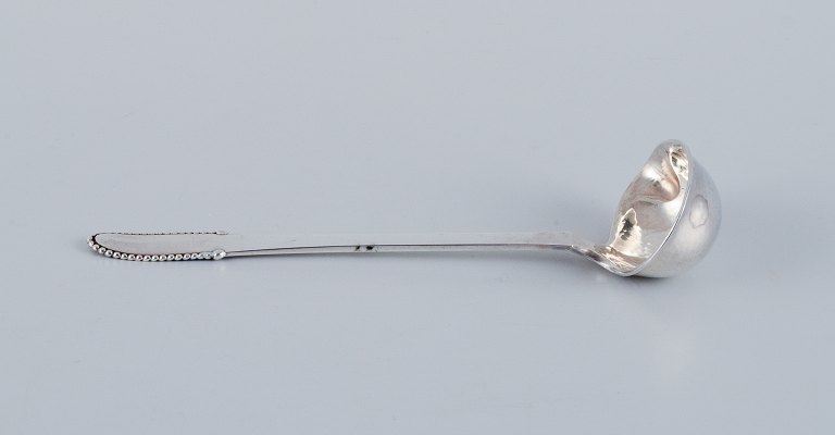 Georg Jensen Beaded.
Butter sauce spoon in sterling silver.