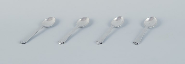 Georg Jensen Pyramid, a set of four large coffee spoons in sterling silver and 
830 silver.