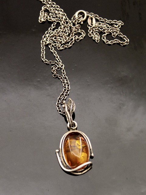 Sterling silver pendant with amber
