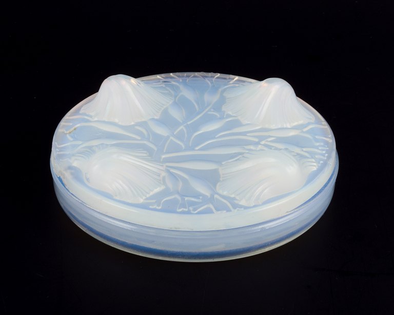 Verlys, France. A covered bowl in art glass. Art Deco opaline glass with a 
bluish tint.