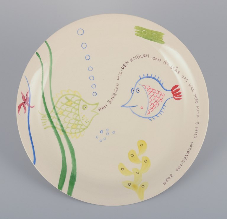 Stig Lindberg for Gustavsberg. "Löja" plate. Hand-painted with a fish motif. 
Satirical illustration with Swedish text.