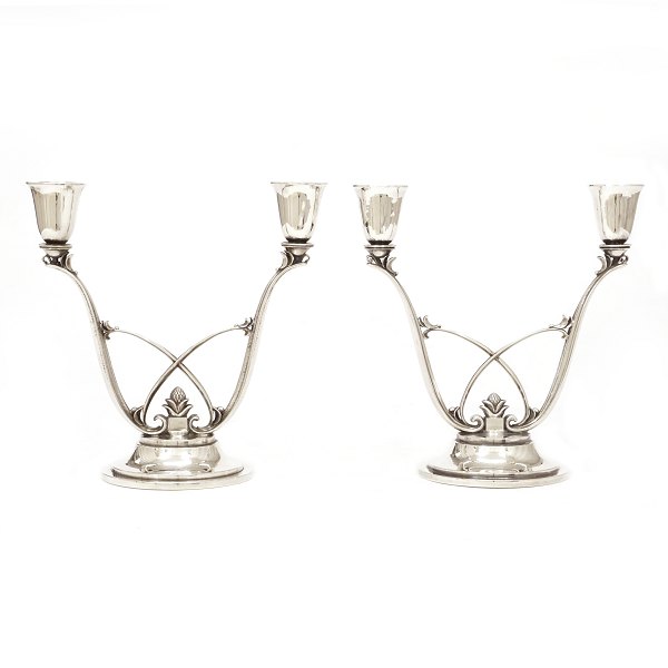 Pair of Georg Jensen sterlingsilver candelabra designed by Harald Nielsen. #619. 
H: 16,8cm. W: 833gr