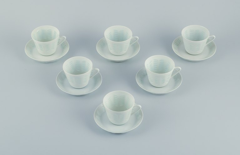 Friedl Holzer-Kjellberg (1905-1993) for Arabia, Finland, a set of six pairs of 
coffee cups and saucers in rice porcelain.