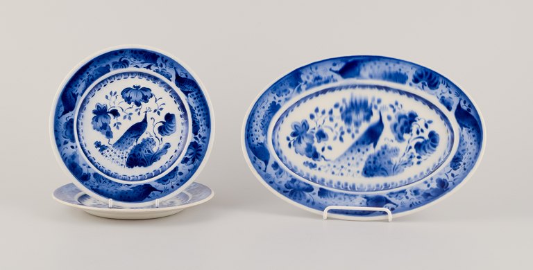 Aluminia, Denmark. Oval dish and two plates. Peacock pattern. Faience.