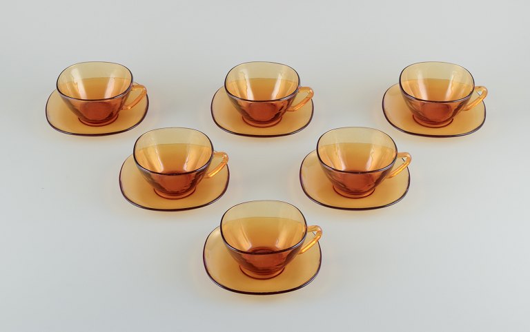 Vereco, France. Six-person tea set in amber glass. Modernist design.