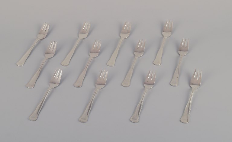 Cohr, Danish silversmith. A set of twelve "Old Danish" cake forks in 830 silver.