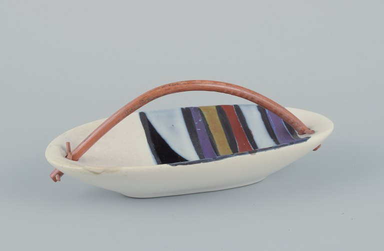 Roger Capron (1922-2006), French ceramist for Vallauris.
Modernist ceramic bowl with a bamboo handle.