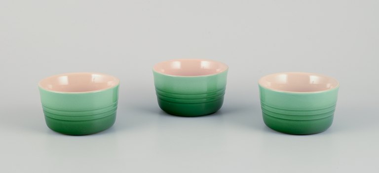 Le Creuset, France. Three green stoneware pie dishes with hand-glazed finish.