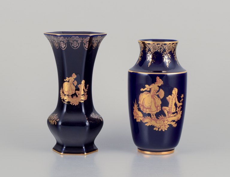 Limoges, France. Two porcelain vases decorated with 22-karat gold leaf and 
beautiful royal blue glaze. Scène galante.