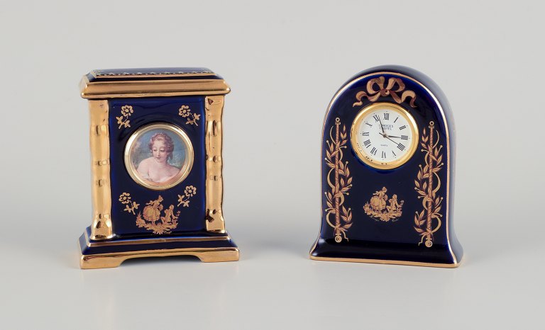 Limoges, France. Clock and decorative object in porcelain, decorated with 
22-karat gold leaf and a beautiful royal blue glaze. Scène galante.