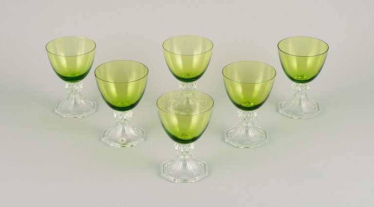 Val St. Lambert, Belgium. A set of six white wine glasses in green and clear 
mouth-blown crystal glass.