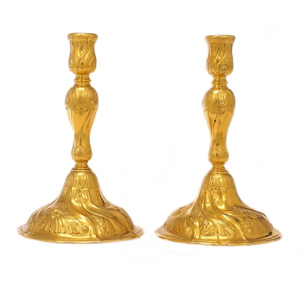 Pair of gilt Rococo style bronze candlesticks. H: 21cm