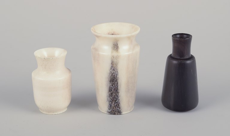 Swedish artist.
Three miniature vases carved from moose bone.