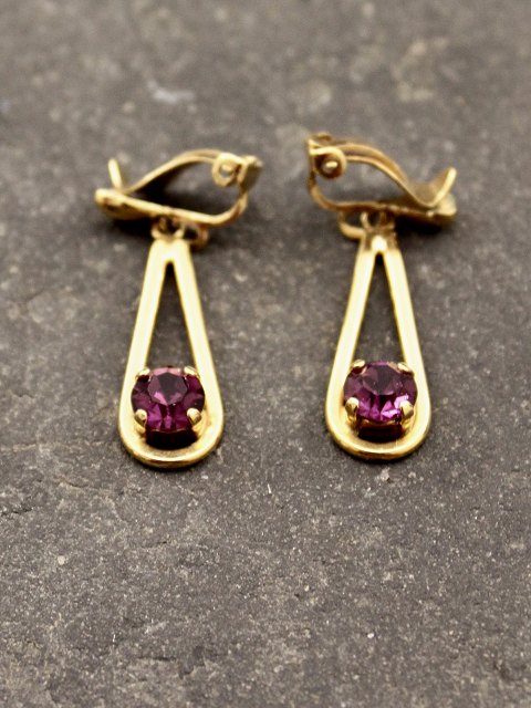 A pair of gold-plated earrings with amethyst
