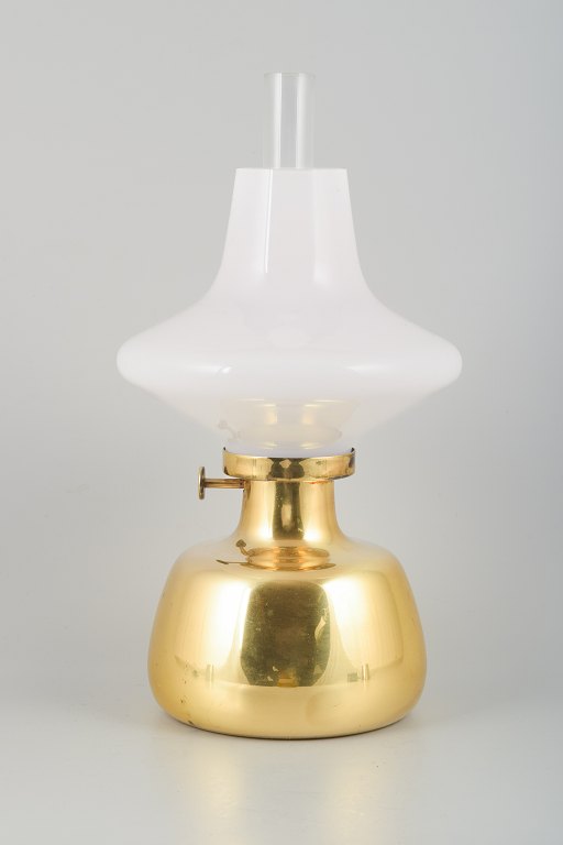 Henning Koppel for Louis Poulsen.
Petronella oil lamp in brass with an opal glass shade.