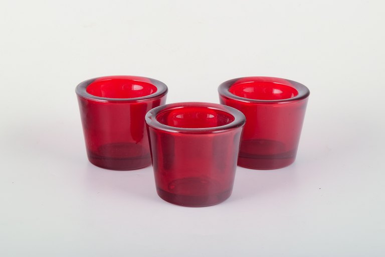 Scandinavian designer.Three tealight holders in red glass.