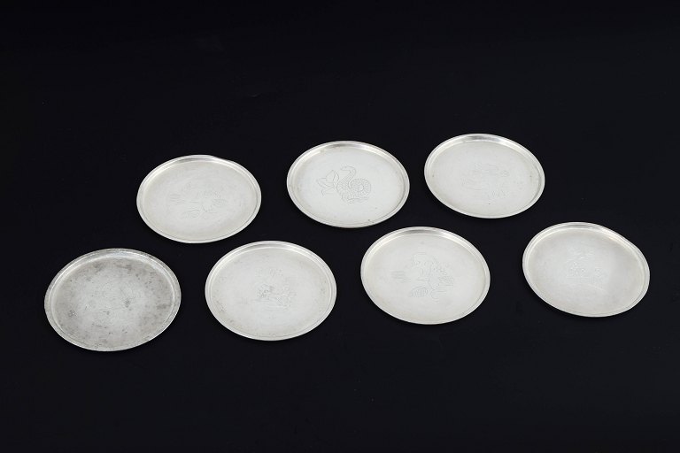 Just Andersen, DenmarkSet of seven pewter bottle coasters.