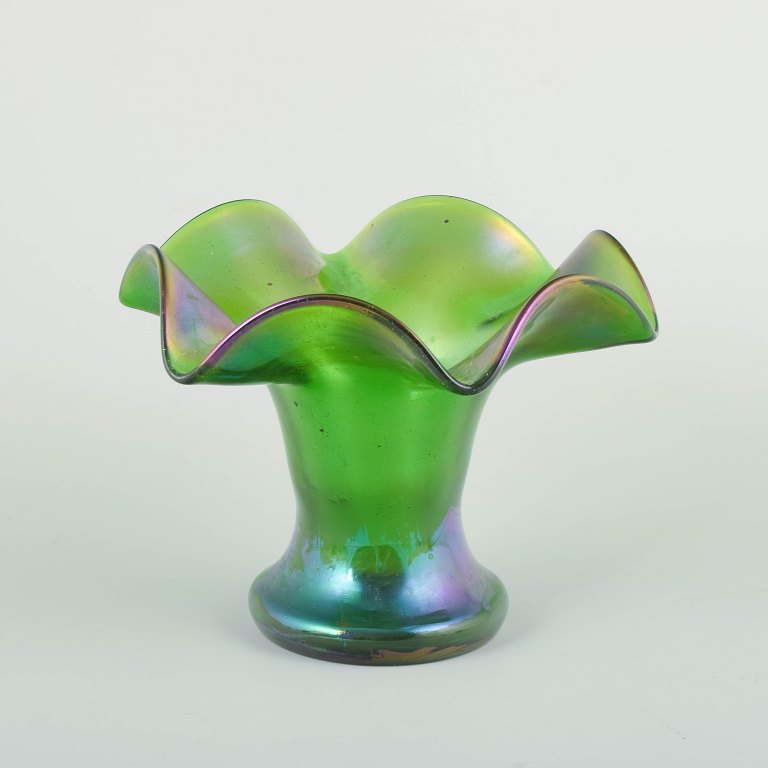 Bohemia, attributed to Loetz. Vase. Ca. 1900.Mouth-blown green glass vase with iridescent surface in violet and blue tones.
