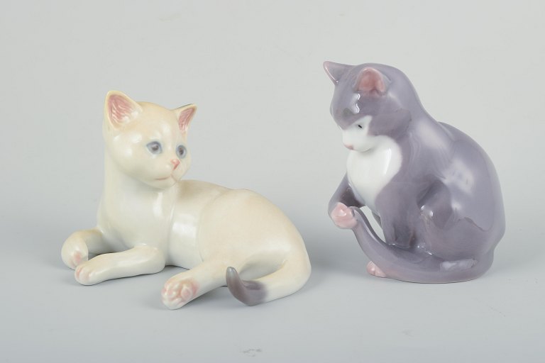 Royal Copenhagen & Bing & Grøndahl. Two porcelain figures, cats. Denmark, 20th 
century.