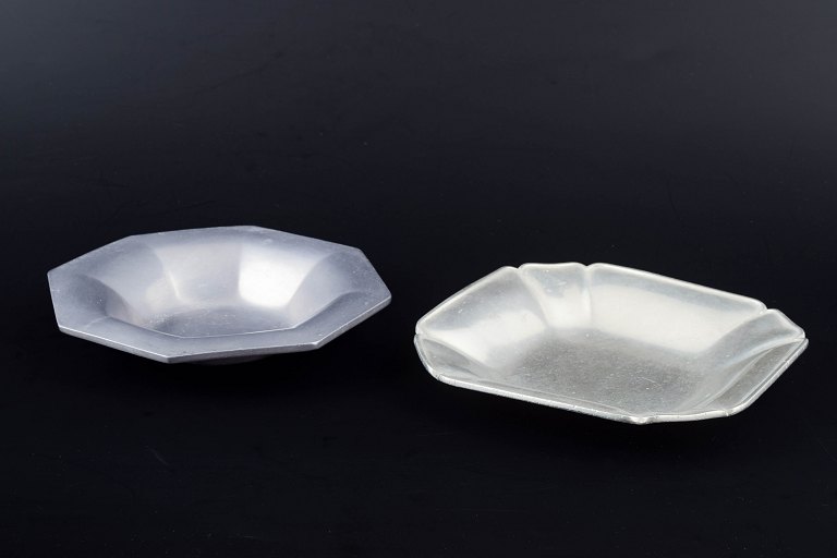Just Andersen, Denmark.Two pewter dishes, one octagonal and the other with rounded angular corners.
