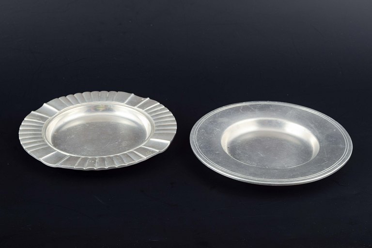 Just Andersen, Denmark.Two pewter dishes, one with fluted rim, the other with simple profiling.