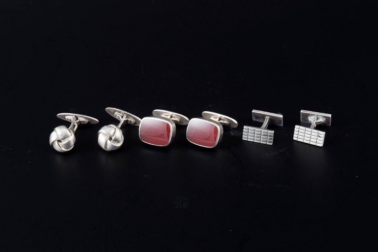 Set of three pairs of cufflinks in silver.