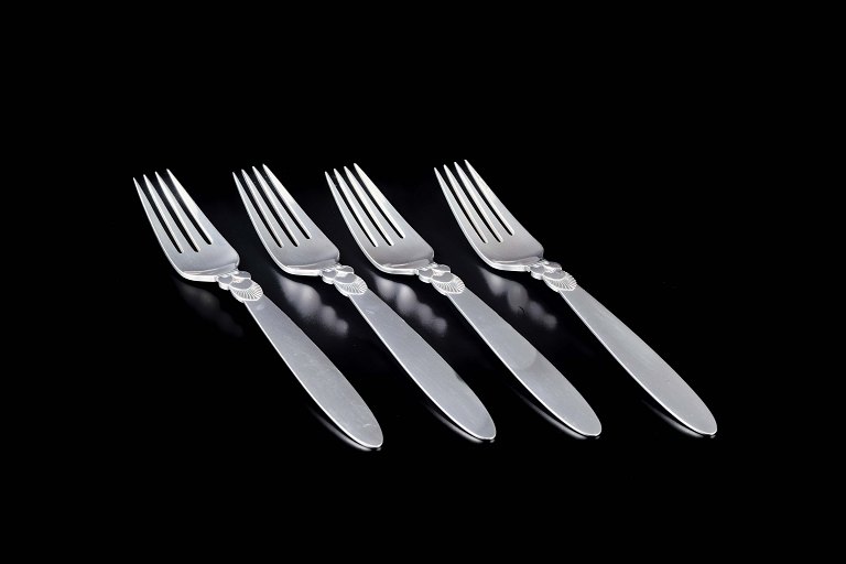 Georg Jensen
Four large dinner forks in the “Cactus” pattern.
Sterling silver.