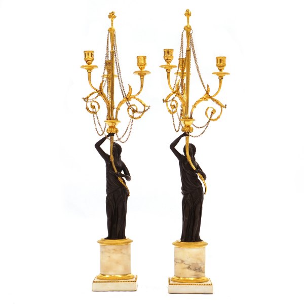 Pair of French firegilt bronze candelabra with marble base. France circa 1810. 
H: 73cm
