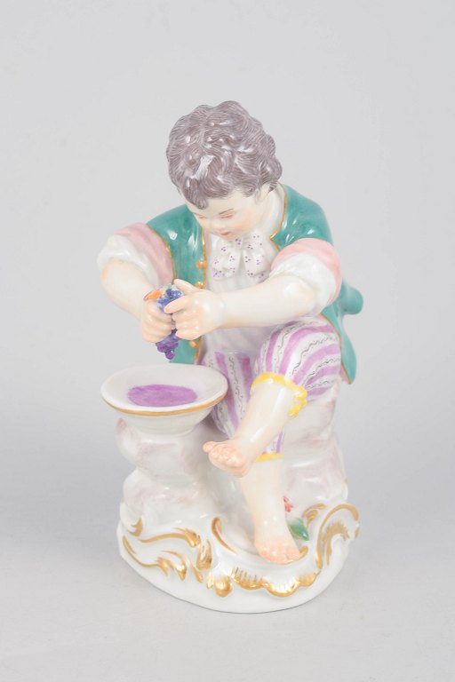 Meissen, boy with grape press figurine.