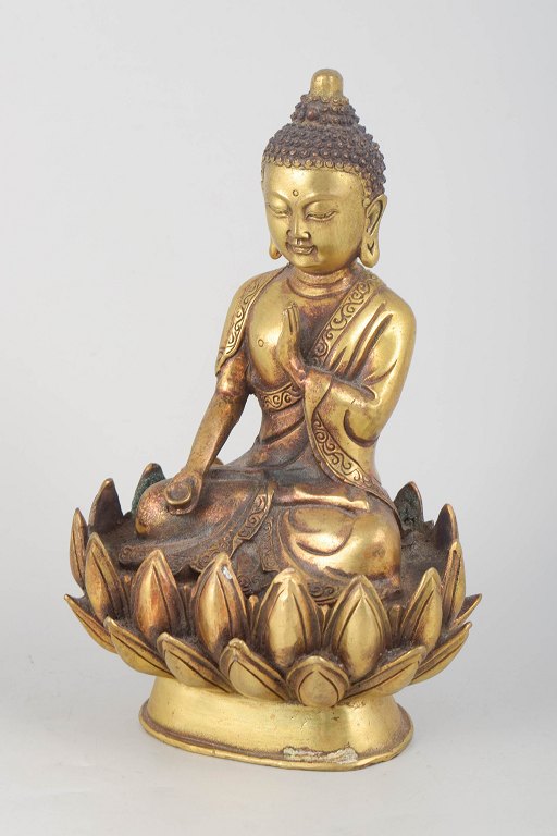 Gilt bronze Buddha figure.